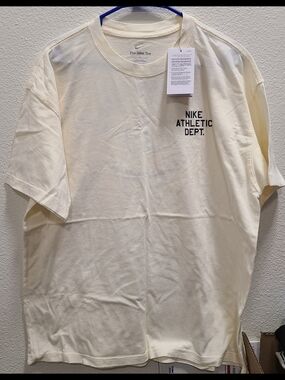 Nike Men's Cream Short Sleeve Tee with Black Chest Print